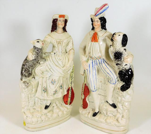 A pair of 19thC. Staffordshire figures depicting m