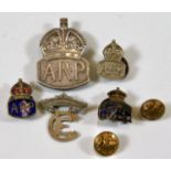 A hallmarked silver ARP badge twinned with other b