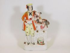 A 19thC. Staffordshire figure depicting man with d