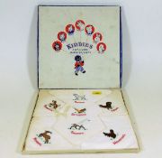 A boxed set of child's silk handkerchiefs with day