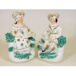 A pair of 19thC. Staffordshire figures depicting l