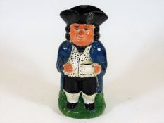 A 19thC. Staffordshire toby jug, slither chip to c