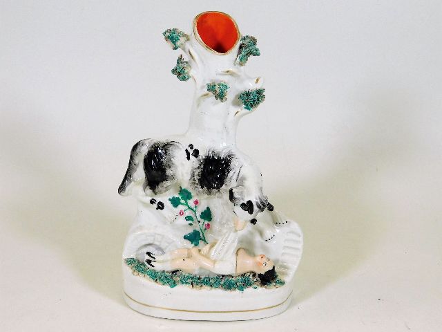A 19thC. Staffordshire spill vase depicting dog pu