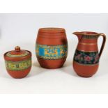 A Prattware terracotta biscuit barrel, three small