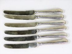 A set of six silver handled butter knives