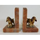 A pair of 1930's marble bookends with cold painted