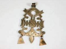 A white metal pendant