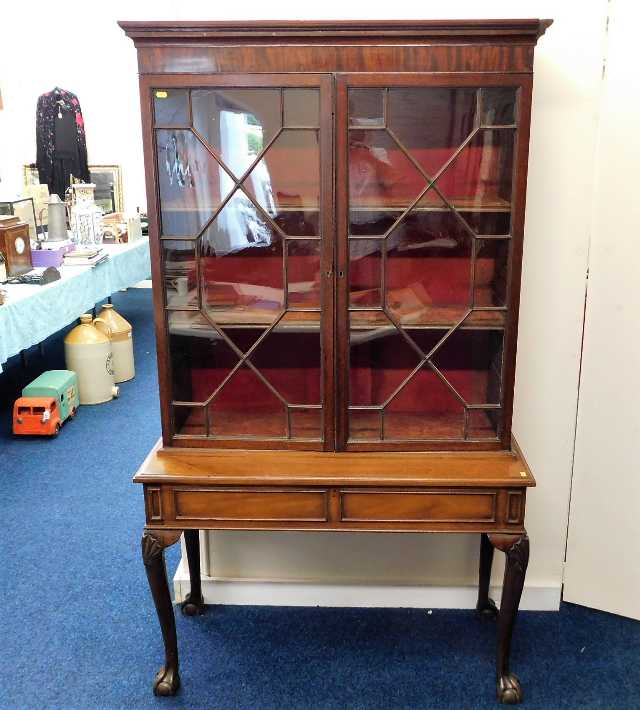 A 19thC. two piece mahogany glazed display cabinet