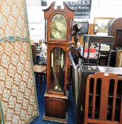 A small modern brass faced longcase clock