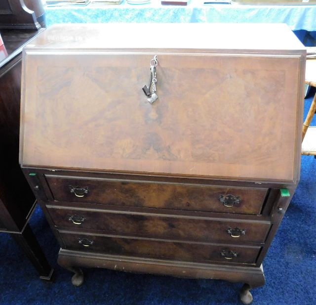 A walnut veneer 20thC. bureau