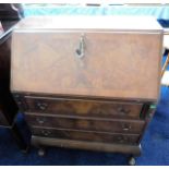 A walnut veneer 20thC. bureau