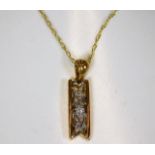 A 9ct gold necklace with pendant with small diamon