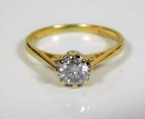 An 18ct gold diamond solitaire ring of approx. 0.6