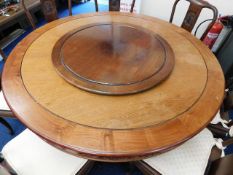 A large metamorphic Chinese rosewood dining table