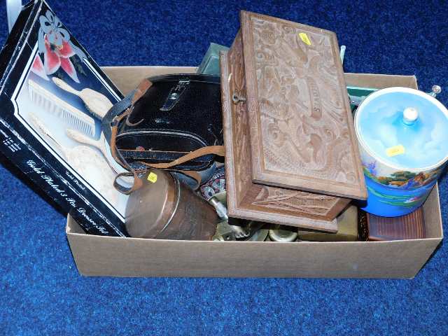 A box with carved dragon decor, a ceramic biscuit