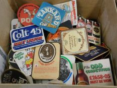 A boxed quantity of vintage beer mats