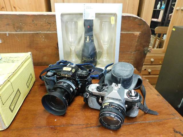 Two 35mm cameras, Minolta & Pentax twinned with a