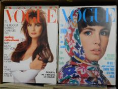 Two boxes of mostly 1980's Vogue magazines with some 1970's, approx. 104 in total, one with tear to