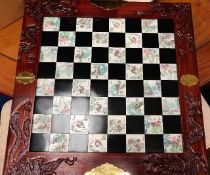 A modern chess case with hand engraved tiles & res