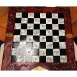 A modern chess case with hand engraved tiles & res