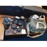 A quantity of vintage camera equipment & lenses in