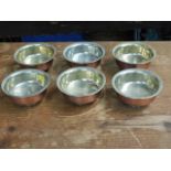 Six Tibetan white metal lined copper dishes