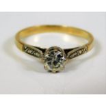 An 18ct gold ring set with white stone