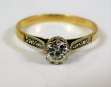 An 18ct gold ring set with white stone