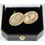 A pair of 9ct gold cufflinks inscribed G.W. 8.9g