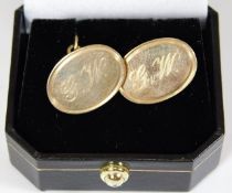 A pair of 9ct gold cufflinks inscribed G.W. 8.9g
