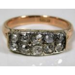 An antique 18ct gold ring set with approx. 2ct of