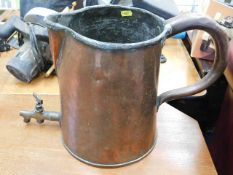 A large Georgian copper jug with brass tap