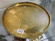 A Hugh Wallis signed brass tray with holly decor