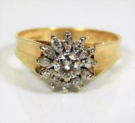 An 18ct gold ring set with a cluster of diamonds a