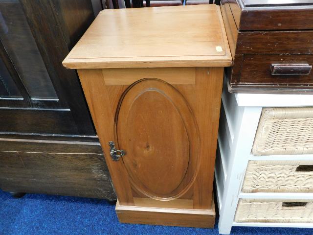 A low level satinwood pot cupboard