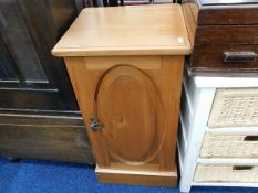 A low level satinwood pot cupboard