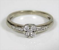 A 9ct white gold diamond ring set with five centre