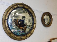 An antique convexed mirror & one other