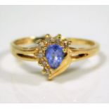 A yellow metal ring set with diamonds & cornflower