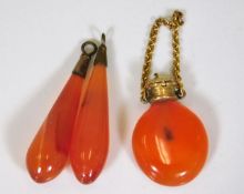A pair of chalcedony earrings twinned with a simil