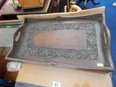 An antique tray with well carved grape & vine deco