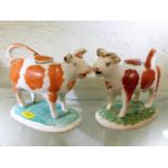 Two 19thC. Staffordshire cow creamers, some faults