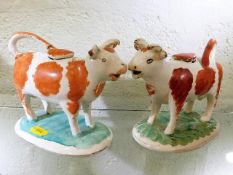 Two 19thC. Staffordshire cow creamers, some faults