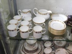 A mixed quantity of gilded Wedgwood & Doulton chin