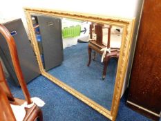 A large modern gilt framed mirror