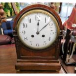 An antique dome cased mantle clock