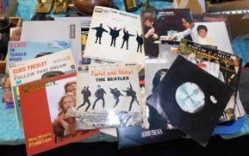 A large tray of vintage vinyl singles, sample show