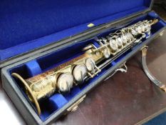 A cased Champion B&M soprano saxophone