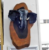 A carved elephant wall plaque