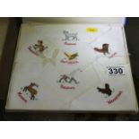 A boxed set of child's silk handkerchiefs with ani